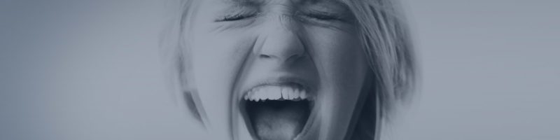 young woman screaming in frustration